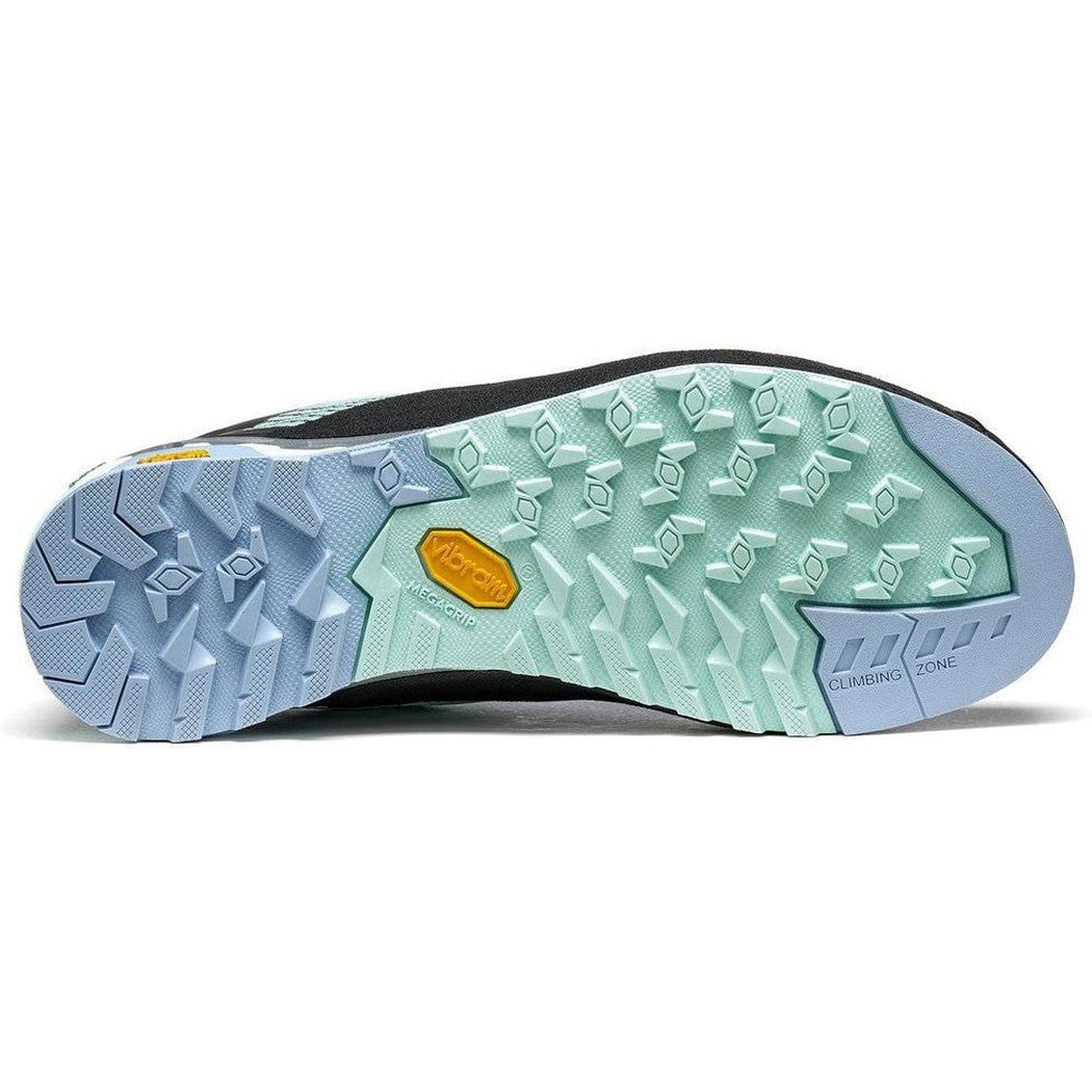 The sole of the Asolo Women's Eldo GV shoe in Brook Green/Blue Fog is shown from below, displaying the lugged tread pattern and climbing zone feature against a white background.