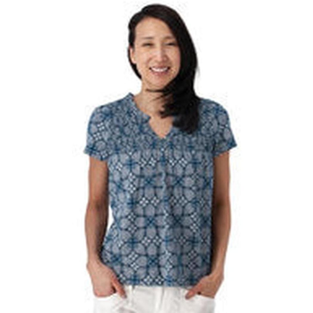 A woman wearing the Aventura Women's Cottage Top in Gibraltar Sea stands against a white background.