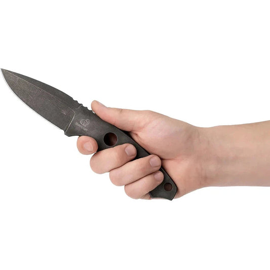 A hand holds the Beavercraft Skeleton Knife with a charcoal/ graphite handle against a white background.