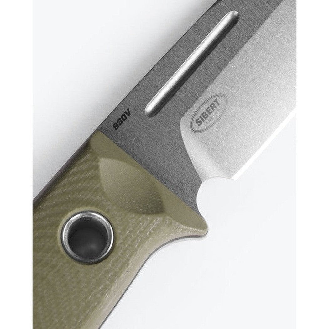 A close-up of the Benchmade Mini Bushcrafter with OD Green G10 handle and a charcoal/gray blade, showing the handle's lanyard hole and the blade's edge.