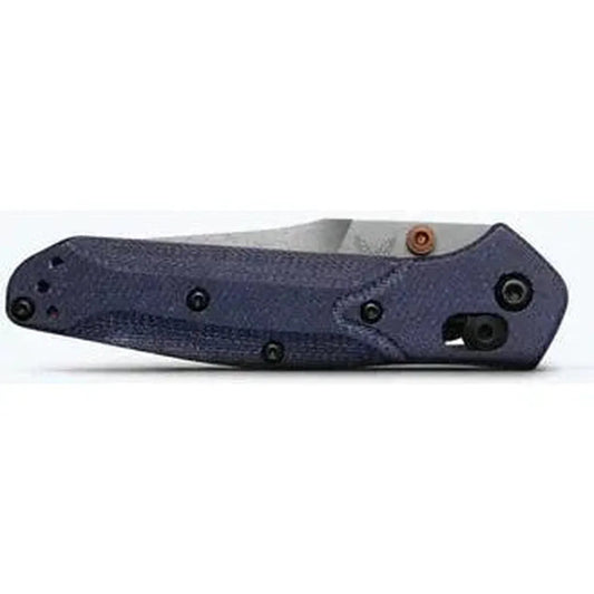 Side view of the Benchmade Mini Osborne knife with a dark blue handle and visible pocket clip against a white background.