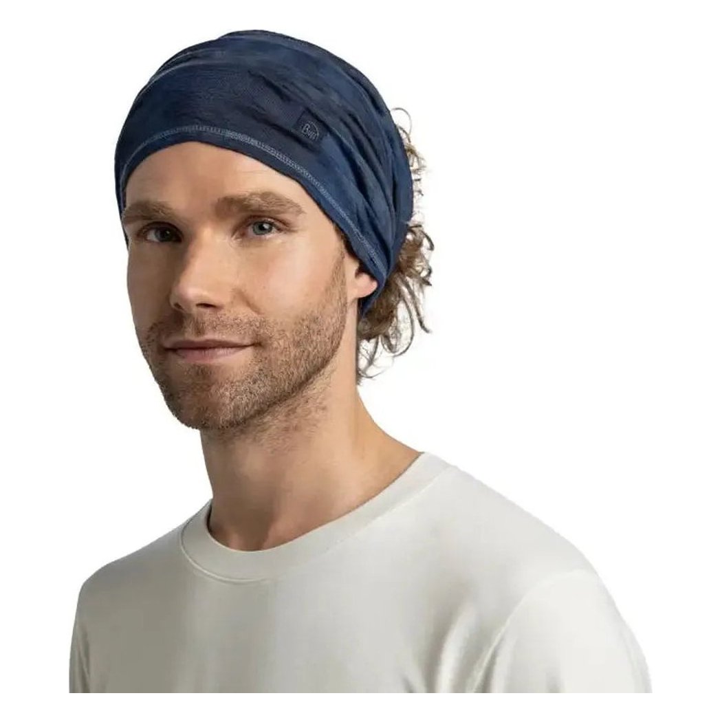 A front view of the Navy Buff Merino Lightweight Natural Tye Dye bandana on a model against a white background.