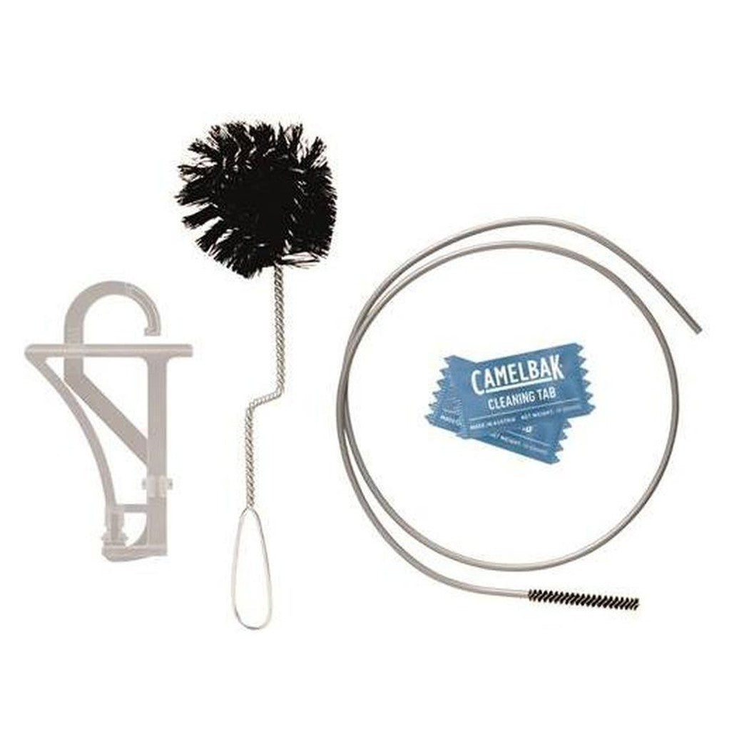 A CamelBak Crux Reservoir Cleaning Kit photo showing a black brush, cleaning tabs, a tube, and a gray bracket against a white background.