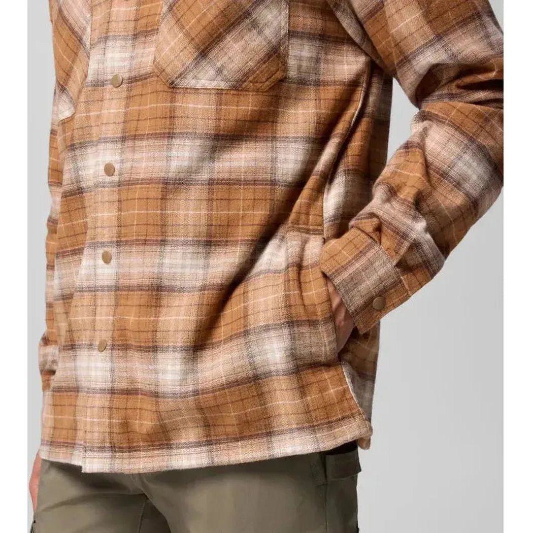 A front view of the Columbia Sportswear Men's Cornell Woods Fleece Lined Shirt Jacket in Delta Lumberjack Tartan, showing the chest pocket and button closure against a plain background.