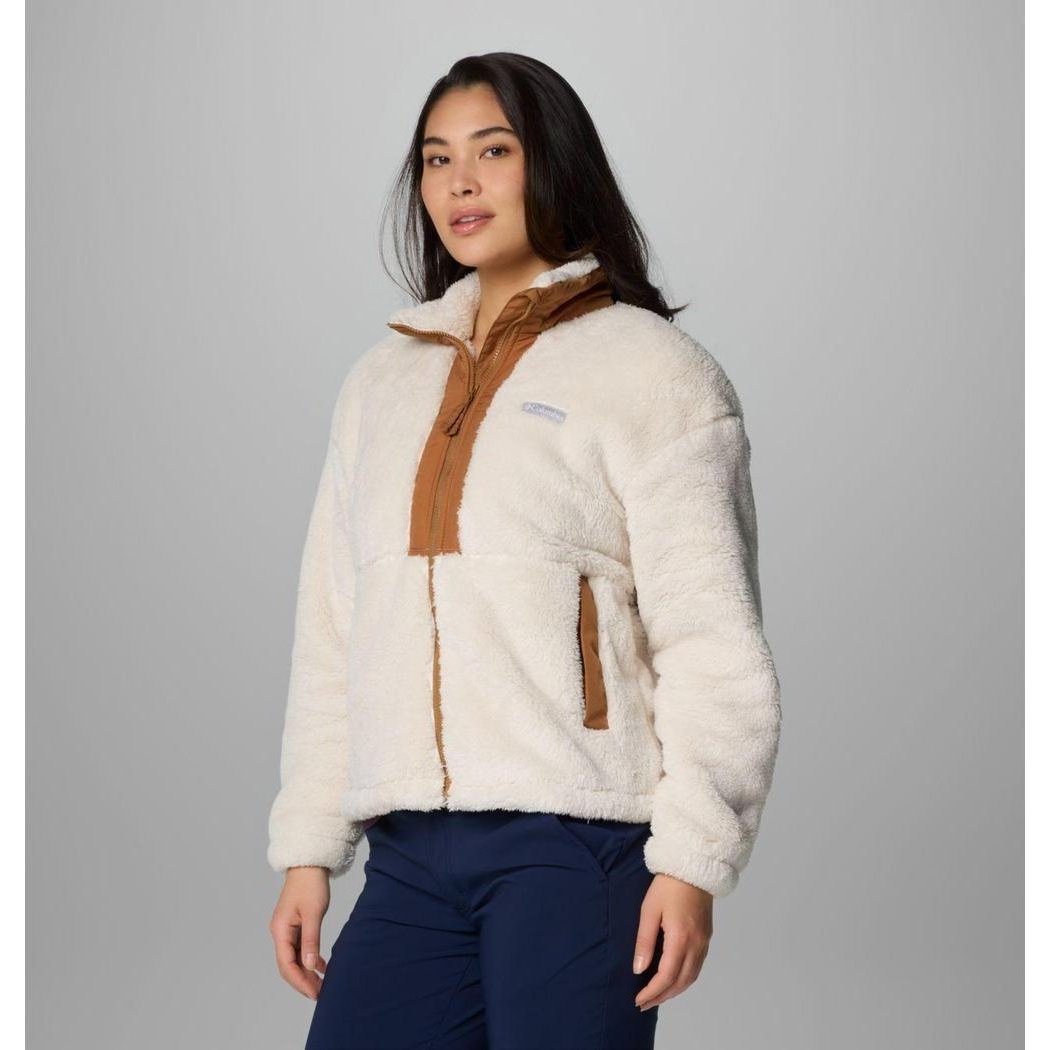 A model wears the Columbia Sportswear Women's Boundless Discovery Sherpa Full Zip II Jacket in Chalk/Camel Brown against a gray background.