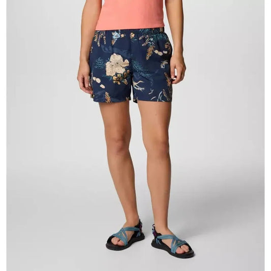 A front view of the Columbia Sportswear Women's Sandy River Printed Short III in Snowdrift Pasteled on a model wearing blue sandals against a plain background.