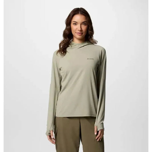 A woman wearing the Columbia Sportswear Women's Skien Valley Hoodie in White stands against a plain white background.