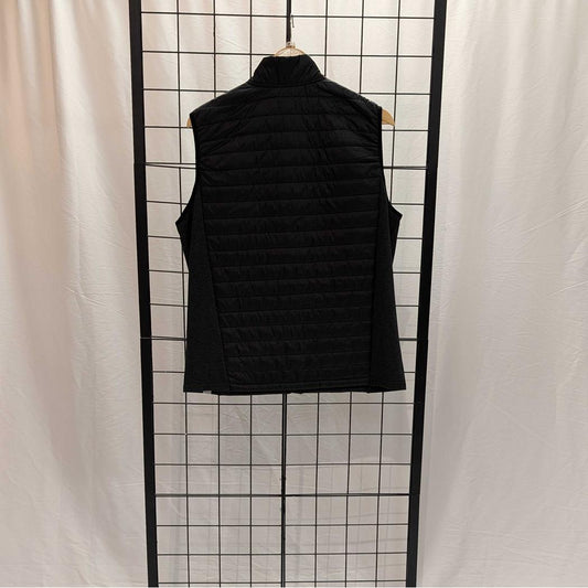 Back view of the Cuyahoga Valley Clothing Company Men's Synthetic Vest in Naval Academy color hanging on a wire grid against a white curtain.