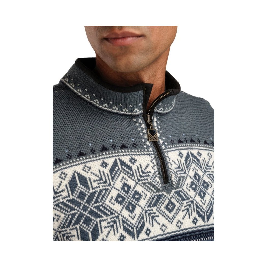 A close-up of the Dale Of Norway Men's Blyfjell Sweater-SAMPLE showing the half-zip collar and patterned design on a model.