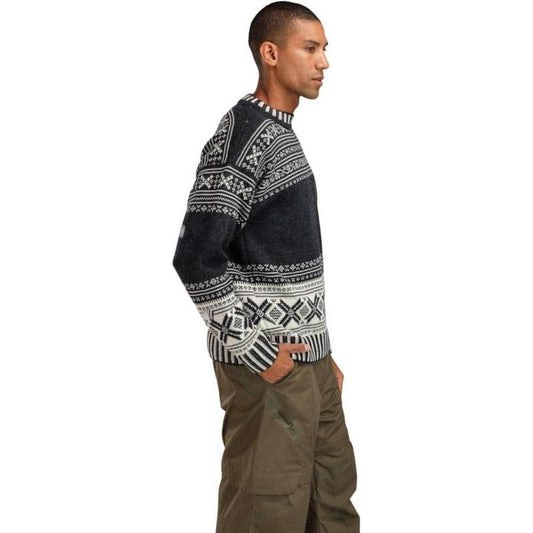 Side view of the Dale Of Norway Men's Torridal Sweater in Darkcharcoal Offwhite showing the patterned design on a white background.