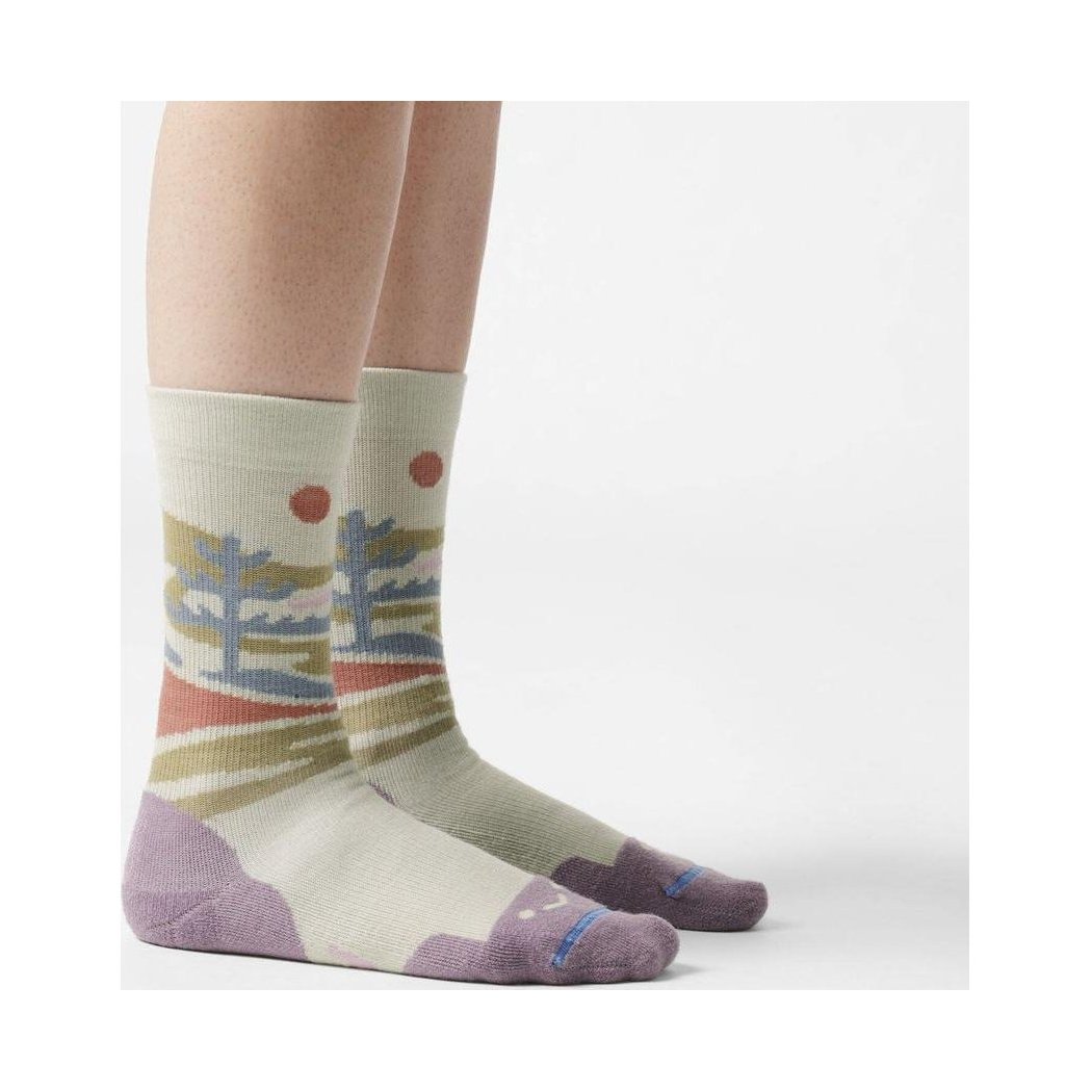 A side view of the FITS Space Desert Original Fit Light Crew socks in Desert Sage, showing the colorful landscape design and purple toe and heel on a white background.