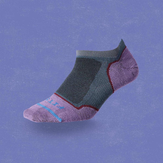 A side view of the FITS Women's Ultra Light Runner No Show sock in Stormy Weather against a blue background.