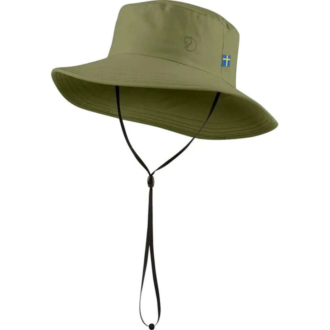 A front view of the Fjallraven Abisko Sun Hat in Black with a chin strap and a small flag patch on the side, against a white background.