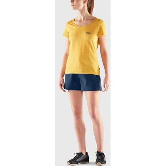 A model wearing Fjallraven Women's High Coast Lite Shorts in Navy stands against a light gray background.