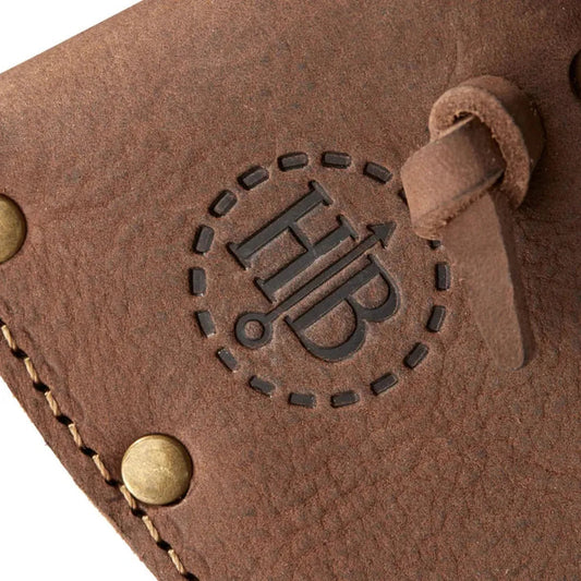 A close-up of the Ågelsjön / Hultån Replacement Sheath in brown showing the embossed HB logo and brass rivets.