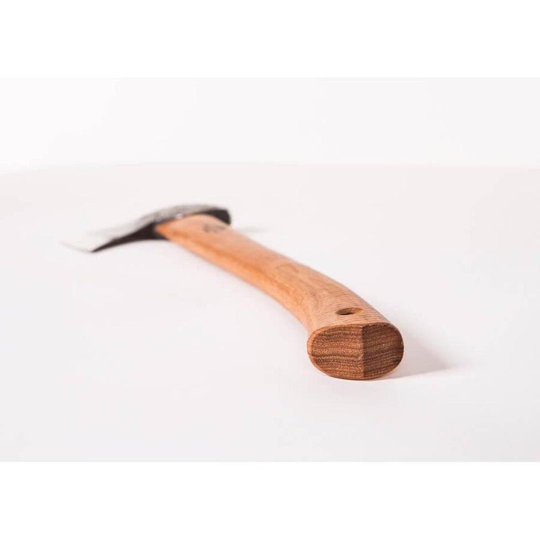 A close-up of the Gransfors Bruk Hunter's Axe with a natural wooden handle and a charcoal-colored metal head, photographed from a low angle against a plain white background.