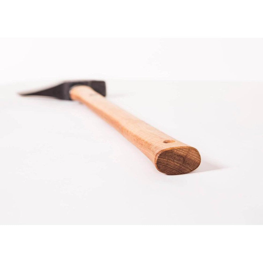 A close-up of the Gransfors Bruk Splitting Maul with a light wooden handle and dark metal head, photographed from a low angle against a plain white background.