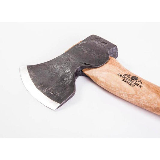 Right bevel Gransfors Bruk Swedish Carving Axe with wooden handle and charcoal blade, photographed from a side angle against a white background.