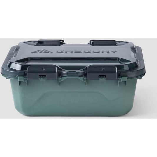A front view of the Gregory Alpaca Gear Box 25 in Nomad Green with a dark lid and latches against a white background.