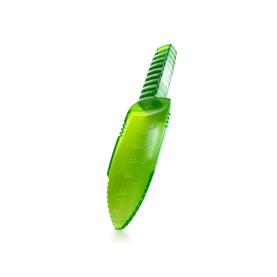 A green GSI Outdoors Cathole Trowel with a ribbed handle is shown from a side angle against a white background.
