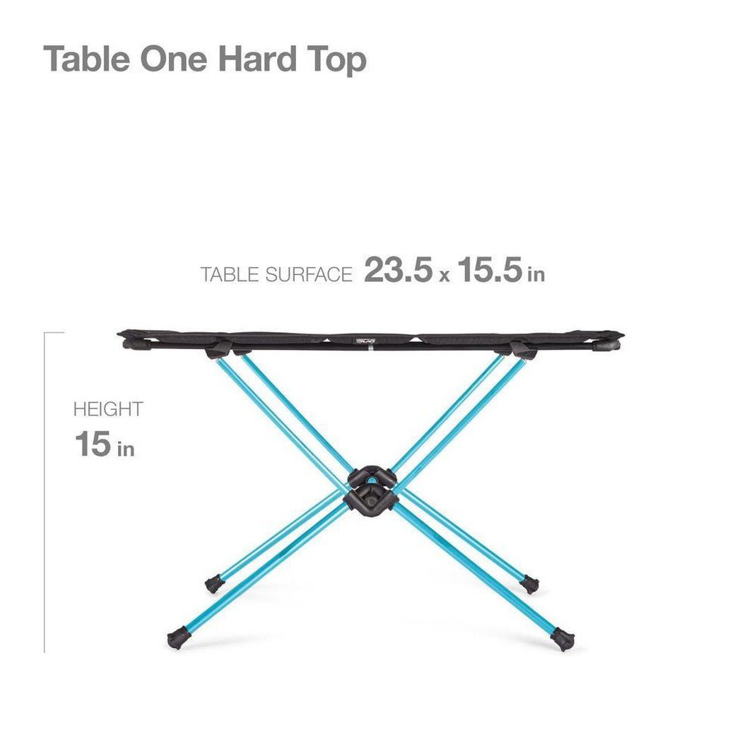 The Helinox Table One Hard Top camping table in black is shown from a front angle with its X-shaped blue legs and 23.5 x 15.5 inch surface.