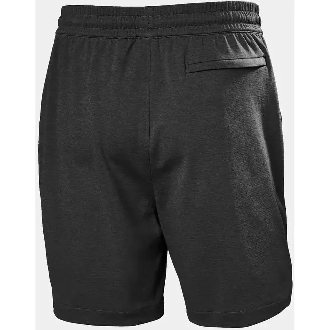 Back view of the Helly Hansen Men's LIFA Tech Lite Shorts in Black showing the elastic waistband and back pocket against a white background.