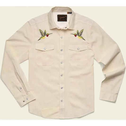 A front view of the Howler Brothers Men's Gaucho Snapshirt in Enter The Dragons color showing embroidered hummingbirds on the chest and buttoned cuffs.