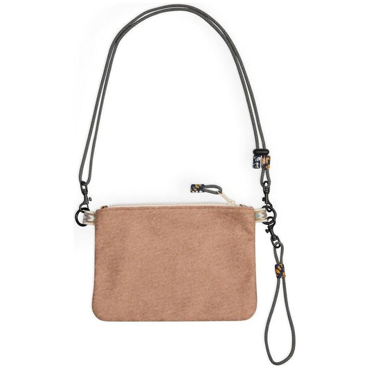 A front view of the Kavu Cozy Cache wallet in Evening Chic with a charcoal strap and zipper pull against a white background.