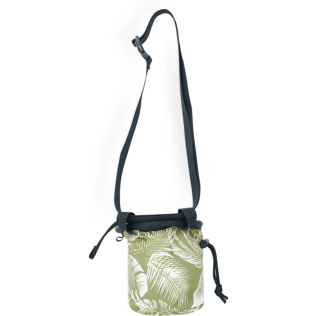 A front view of the Kavu Keep Climbing chalk bag in Calm Palm with a black strap and drawstring closure against a white background.