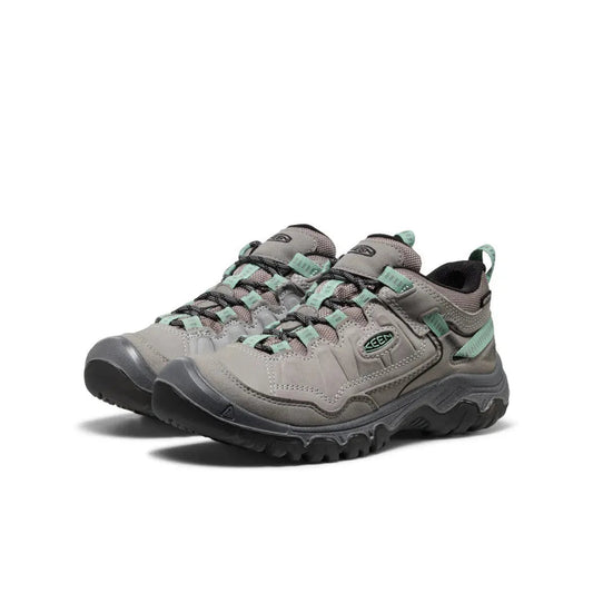 Side view of the Keen Women's Targhee IV Waterproof Hiking Shoe in Alloy/Granite Green with a lugged outsole against a white background.