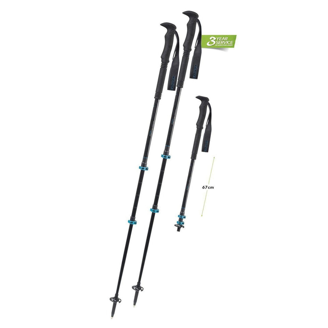 Two Komperdell Carbon C3 Pro trekking poles in charcoal/graphite with blue accents and a 67cm extension visible against a white background.