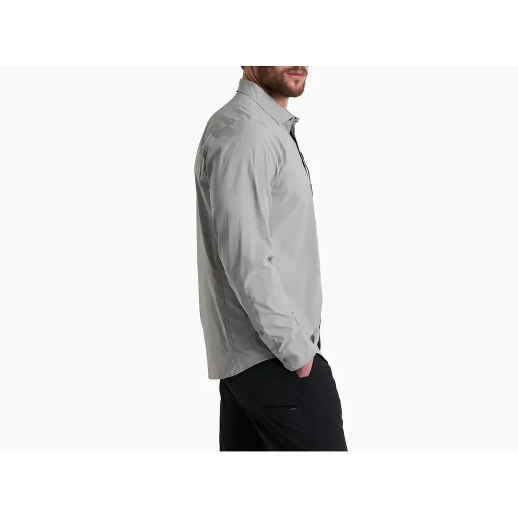 Side view of the Kuhl Men's Driftr Long Sleeve in Concrete Grey showing the model wearing it against a white background.