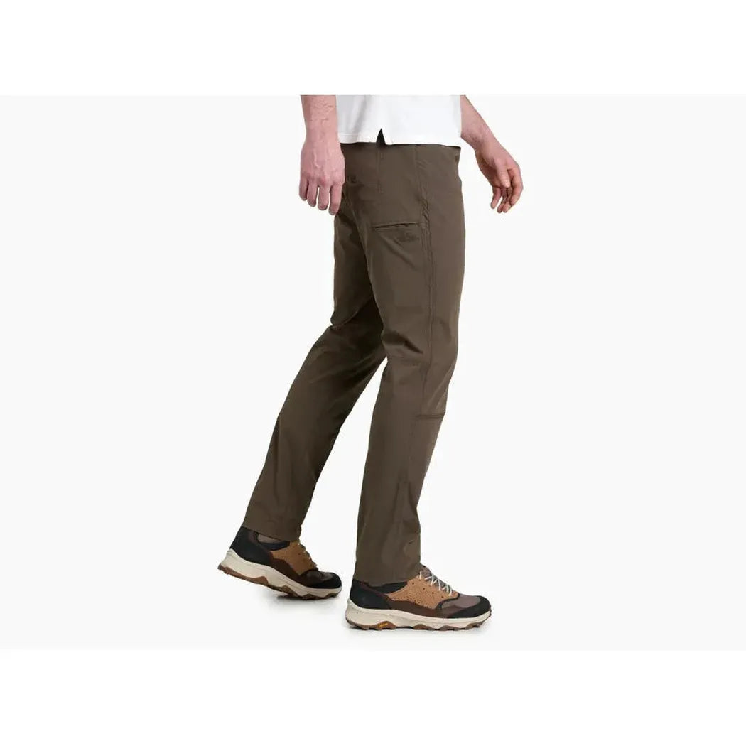 Side view of the Kuhl Men's Free Radikl in Vintage Green showing the pocket and model wearing them against a white background.