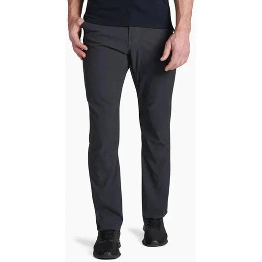 A front view of the Kuhl Men's Renegade Pant in Buckskin Khaki on a model against a white background.