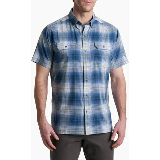 A front view of the Kuhl Men's Response short - sleeve plaid shirt in Ember Red on a model against a white background.
