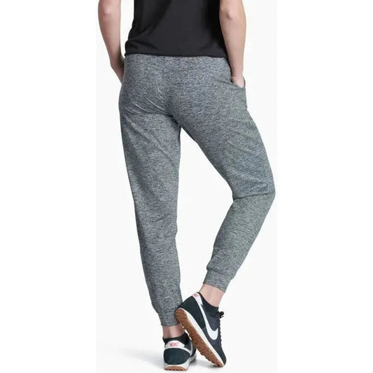 Back view of the Kuhl Women's Bliss Joggr in Dark Heather showing the cuffed hem and model wearing them against a white background.