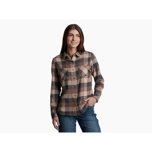 A woman wearing the Kuhl Women's Darcy Flannel in Cherrywood stands against a plain white background.