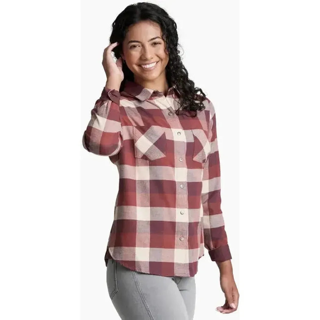 A woman wearing the Kuhl Women's Darcy Flannel in Cherrywood poses against a white background.