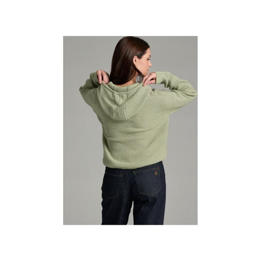 Back view of the Kuhl Women's Fireside Sweater Hoody in Sea Crest on a model wearing dark jeans against a gray background.