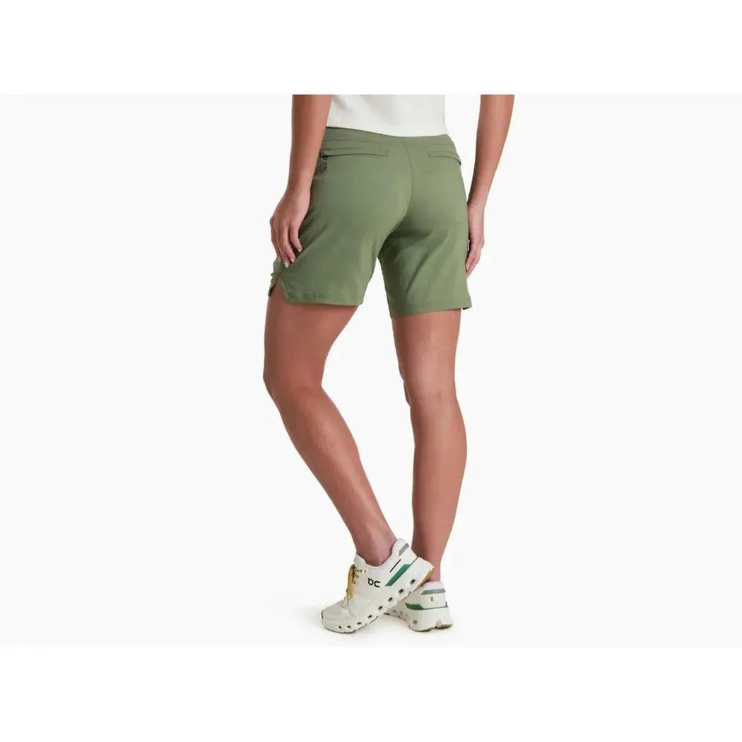 Back view of the Kuhl Women's Haven Short 7' in Slate Green on a model wearing white sneakers against a white background.