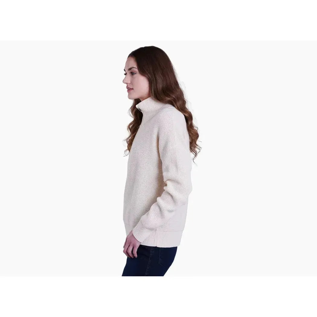Side view of the Kuhl Women's Norda 1/4 Zip Sweater in Stone on a model against a white background.