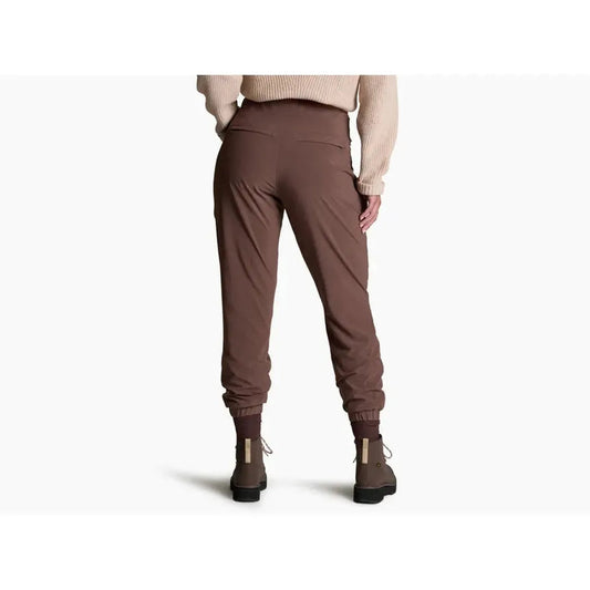 Back view of the Kuhl Women's Vantage Lined Pant in Coffee showing the high waist and cuffed ankles on a model against a white background.