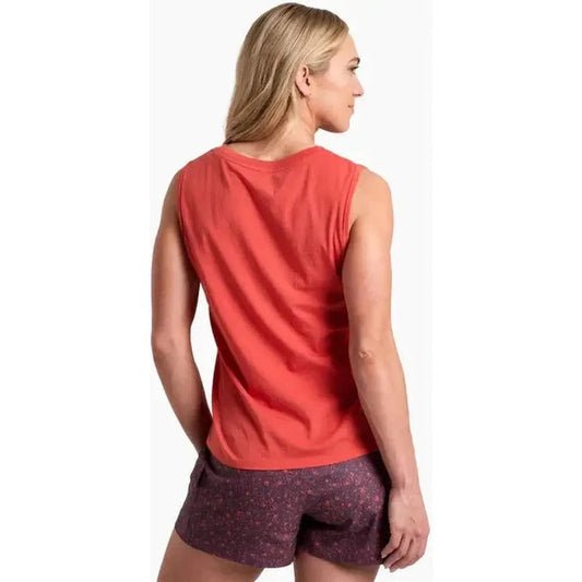 Back view of the Kuhl Women's Vega Tank in Sunset on a model wearing purple shorts against a white background.