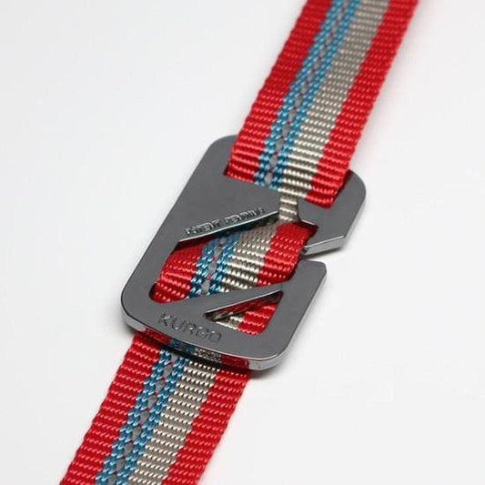 A close-up of the Kurgo Walk About No Pull Leash in Charcoal/Chilli showing the metal buckle and red, gray, and blue striped webbing against a white background.