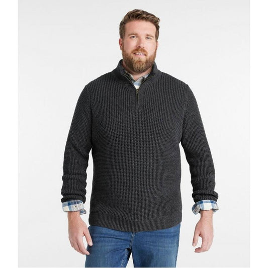 A front view of the L.L.Bean Men's Organic Cotton Waffle Quarter Zip Sweater in Faded Black on a model wearing blue jeans against a white background.
