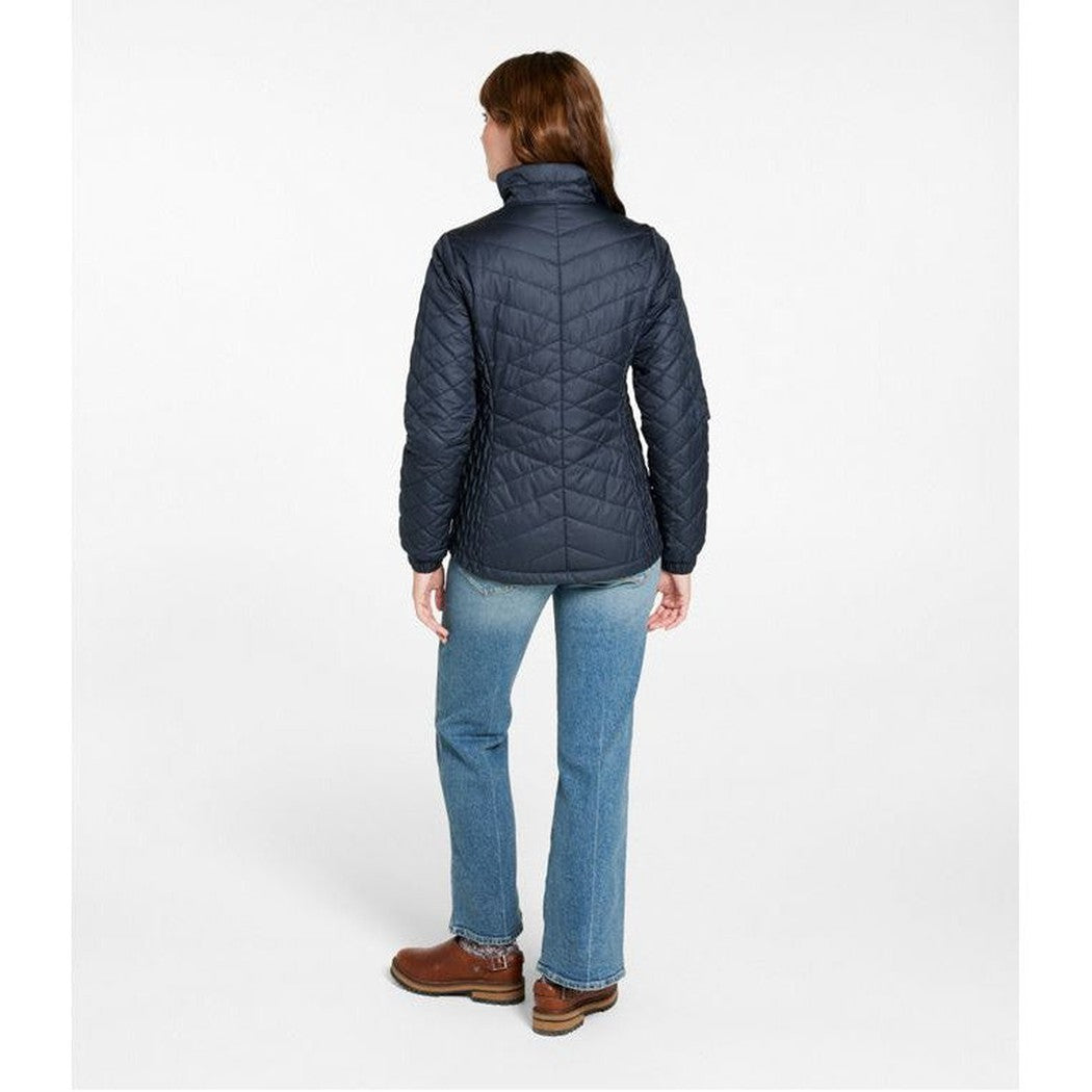 Back view of the L.L.Bean Women's Regular Fleece Lined Primaloft Jacket in Carbon Navy on a model wearing blue jeans and brown boots against a white background.