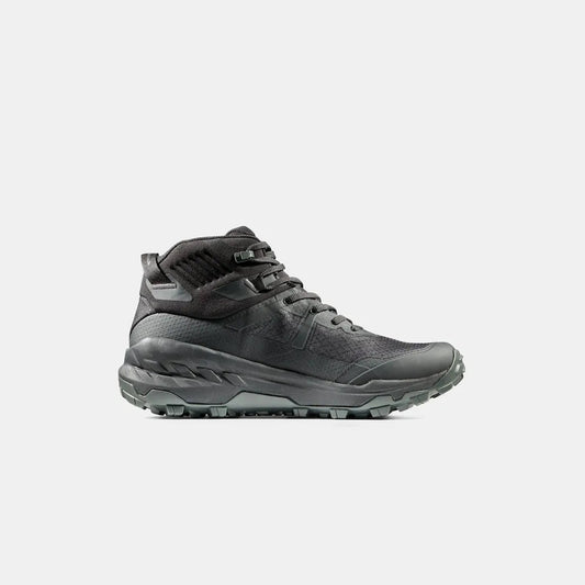 Side view of the Mammut Sports Group Sertig II Mid GTX Men in Black showing the lugged outsole against a white background.