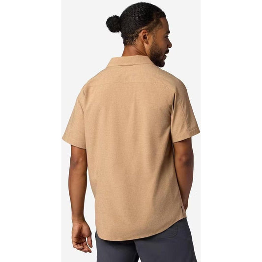 Back view of the Marmot Men's Spring Creek Short Sleeve in DromedaryHeathe on a model against a white background.