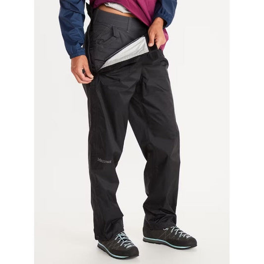 A model wearing black Marmot Women's PreCip Eco Full Zip Pants with a white background.