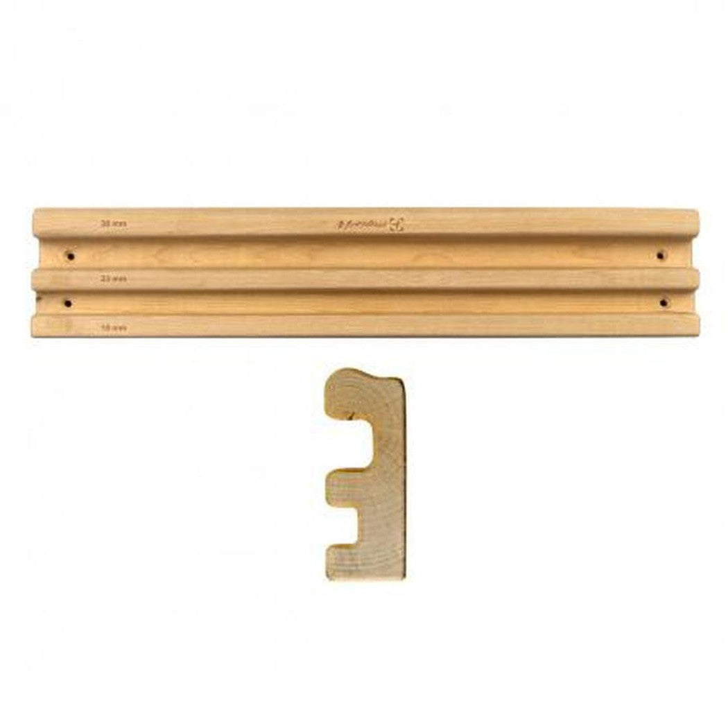 A top-down view of the Metolius Prime Rib wooden training board with a matching wooden handle, displayed against a white background.